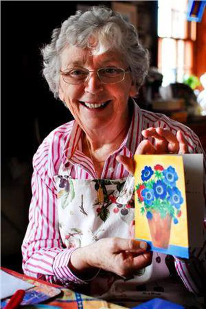 grandma smiling with card. alert1 medical alert systems grandma smiling with card. alert1 medical alert systems
